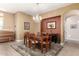 Dining room featuring a beautiful light fixture and a large rug at 5721 W Molly Ln, Phoenix, AZ 85083