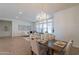Open concept: dining area featuring a chandelier and seamless flow to the living room at 5721 W Molly Ln, Phoenix, AZ 85083