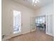 Bright entryway with tile floors, glass doors, and a view of the dining area at 5721 W Molly Ln, Phoenix, AZ 85083