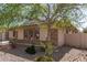 Single-Gathering home with beautiful desert landscaping with rock ground cover at 5721 W Molly Ln, Phoenix, AZ 85083