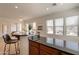 Bright eat-in kitchen with breakfast bar and adjacent to dining area beyond at 5721 W Molly Ln, Phoenix, AZ 85083