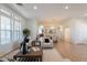 Spacious open-concept living area with seamless flow to dining and kitchen areas; bright and inviting at 5721 W Molly Ln, Phoenix, AZ 85083