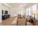 Bright living room filled with natural light, neutral tones, stylish furniture, and a ceiling fan at 5721 W Molly Ln, Phoenix, AZ 85083