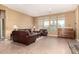 Spacious living room filled with natural light with a beautiful tile floor and fireplace at 5721 W Molly Ln, Phoenix, AZ 85083