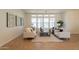 Bright living room featuring neutral furniture, modern decor, and large windows for natural light at 5721 W Molly Ln, Phoenix, AZ 85083