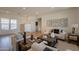 Spacious living room featuring a modern decor, large windows, and an open layout at 5721 W Molly Ln, Phoenix, AZ 85083