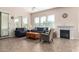 Bright living room with a cozy fireplace, large windows, and comfortable seating, creating an inviting atmosphere at 5721 W Molly Ln, Phoenix, AZ 85083