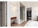Bathroom featuring vanity, glass shower, and walk-in closet with ample storage at 5721 W Molly Ln, Phoenix, AZ 85083