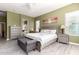Spacious main bedroom with stylish furniture, gray walls, and a decorative ceiling fan at 5721 W Molly Ln, Phoenix, AZ 85083