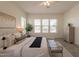 Spacious main bedroom with light grey vinyl floors, a ceiling fan, and three large windows at 5721 W Molly Ln, Phoenix, AZ 85083