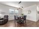 Contemporary dining area with stylish furniture and modern lighting fixtures near large windows at 5875 N 195Th Dr, Litchfield Park, AZ 85340