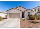 Beautiful single-story home with a two-car garage and desert-friendly landscaping at 5875 N 195Th Dr, Litchfield Park, AZ 85340