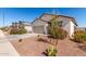 Attractive single-story home boasting a two-car garage, xeriscaping, and desert plants at 5875 N 195Th Dr, Litchfield Park, AZ 85340