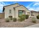 Charming single-story house showcasing desert landscaping, a neutral exterior, and an attached two-car garage at 5908 W Autumn Vista Way, Florence, AZ 85132