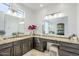 Bathroom featuring dual sinks, granite counters, and a makeup vanity at 7745 E Calle De Las Brisas --, Scottsdale, AZ 85255
