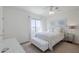 Bright bedroom with white walls, a bed, tufted bench, and a window at 7745 E Calle De Las Brisas --, Scottsdale, AZ 85255