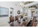 The dining area showcases a large dark wood table, seating for eight, and modern light fixture at 7745 E Calle De Las Brisas --, Scottsdale, AZ 85255
