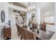 Open-concept dining area with a dark wood table, staircase, and seamless flow to the living spaces at 7745 E Calle De Las Brisas --, Scottsdale, AZ 85255