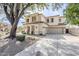 Elegant two-story home with a three-car garage and manicured front yard at 7745 E Calle De Las Brisas --, Scottsdale, AZ 85255