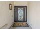 Close-up of the intricate wrought iron front door with a decorative welcome mat at 7745 E Calle De Las Brisas --, Scottsdale, AZ 85255