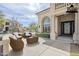 Inviting front porch with decorative columns and outdoor seating, perfect for relaxing at 7745 E Calle De Las Brisas --, Scottsdale, AZ 85255