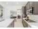 Modern kitchen with stainless steel appliances and a view into the dining room at 7745 E Calle De Las Brisas --, Scottsdale, AZ 85255
