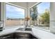 A sink with a view of a backyard, letting in natural light at 7745 E Calle De Las Brisas --, Scottsdale, AZ 85255