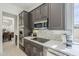 Close up on the modern kitchen appliances and marble backsplash at 7745 E Calle De Las Brisas --, Scottsdale, AZ 85255