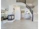 A bright living room with high ceilings, a fireplace, and a staircase at 7745 E Calle De Las Brisas --, Scottsdale, AZ 85255