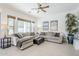 Bright living room with neutral tones, tile flooring, comfortable seating and large window at 7745 E Calle De Las Brisas --, Scottsdale, AZ 85255