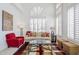 Bright living room with high ceilings, arched windows with white shutters, and stylish furnishings at 7745 E Calle De Las Brisas --, Scottsdale, AZ 85255