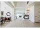 Open-concept living room with fireplace and views into dining area at 7745 E Calle De Las Brisas --, Scottsdale, AZ 85255