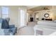 Bright main bedroom with a cozy sitting area, desk, tray ceiling and exterior access at 7745 E Calle De Las Brisas --, Scottsdale, AZ 85255