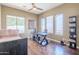 Bright office with desk setup, natural light, hardwood flooring and view of backyard at 7745 E Calle De Las Brisas --, Scottsdale, AZ 85255