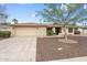 Attractive single-story home with a well-manicured desert landscape and a two-car garage at 7800 E Via Del Futuro E --, Scottsdale, AZ 85258