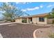 Inviting home featuring low-maintenance desert landscaping, mature trees, and a welcoming front entrance at 7800 E Via Del Futuro E --, Scottsdale, AZ 85258