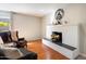 Cozy living room with hardwood floors, fireplace, and ample seating area at 7800 E Via Del Futuro E --, Scottsdale, AZ 85258