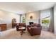 Living room area with seating by fireplace and ample natural light at 7800 E Via Del Futuro E --, Scottsdale, AZ 85258