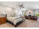 Spacious main bedroom with a ceiling fan, fireplace, and cozy seating area at 7800 E Via Del Futuro E --, Scottsdale, AZ 85258