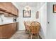 Inviting dining area adjacent to kitchen features modern light fixture at 849 E Lancaster Cir, Florence, AZ 85132