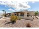 Desert-landscaped townhome featuring a private entryway and covered patio at 849 E Lancaster Cir, Florence, AZ 85132