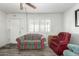 Cozy living room with bright natural light and durable laminate flooring at 849 E Lancaster Cir, Florence, AZ 85132