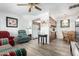 Comfortable living space with laminate flooring flowing into the kitchen and dining area at 849 E Lancaster Cir, Florence, AZ 85132