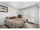Serene main bedroom with laminate flooring and access to the patio at 849 E Lancaster Cir, Florence, AZ 85132