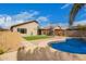 Escape to this backyard with a private pool, desert landscaping, and lush turf area at 8867 E Avenida Las Noches --, Gold Canyon, AZ 85118