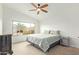 A bright bedroom with a ceiling fan, large window, and stylish furnishings, offering a peaceful retreat at 8867 E Avenida Las Noches --, Gold Canyon, AZ 85118