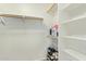 Spacious walk-in closet with ample shelving and wooden racks, perfect for organization and storage at 8867 E Avenida Las Noches --, Gold Canyon, AZ 85118