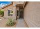 Inviting home entrance featuring a secure screen door, desert landscaping, and a well-maintained walkway at 8867 E Avenida Las Noches --, Gold Canyon, AZ 85118