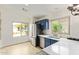 Bright kitchen with stainless steel appliances, blue cabinets, white quartz countertops, and natural light at 8867 E Avenida Las Noches --, Gold Canyon, AZ 85118