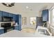 Well-lit kitchen with white countertops, stainless steel appliances, blue cabinets, and a sleek black microwave at 8867 E Avenida Las Noches --, Gold Canyon, AZ 85118